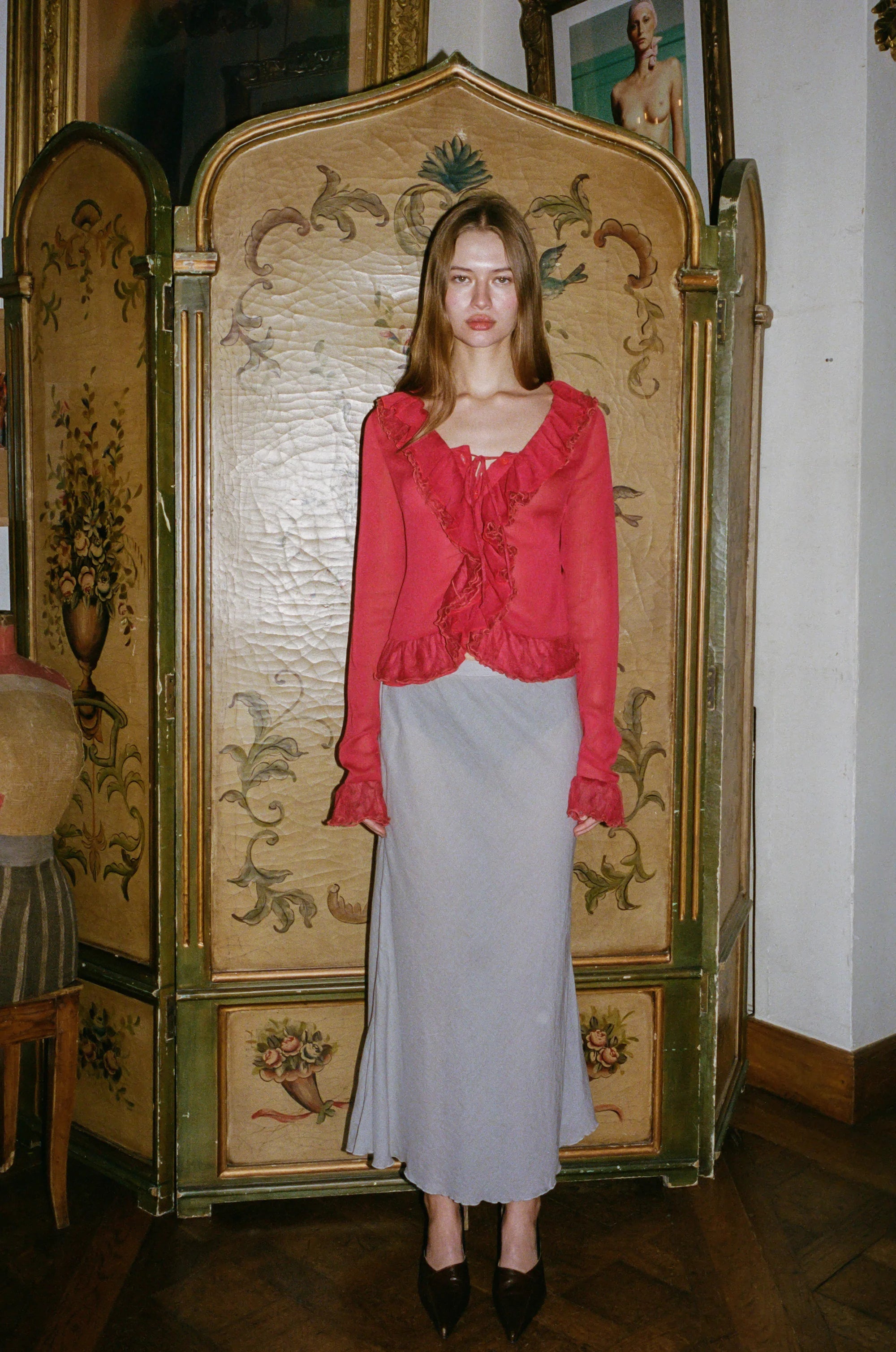 Indulge in the luxuriously elegant Maia Blouse by With Jean. With long sleeves, delicate ruffle detailing, and a semi-sheer design, this blouse exudes sophistication and charm. The button front closure adds a touch of understated class, making it the perfect addition to any upscale wardrobe. Unleash your inner fashionista with this exclusive piece.