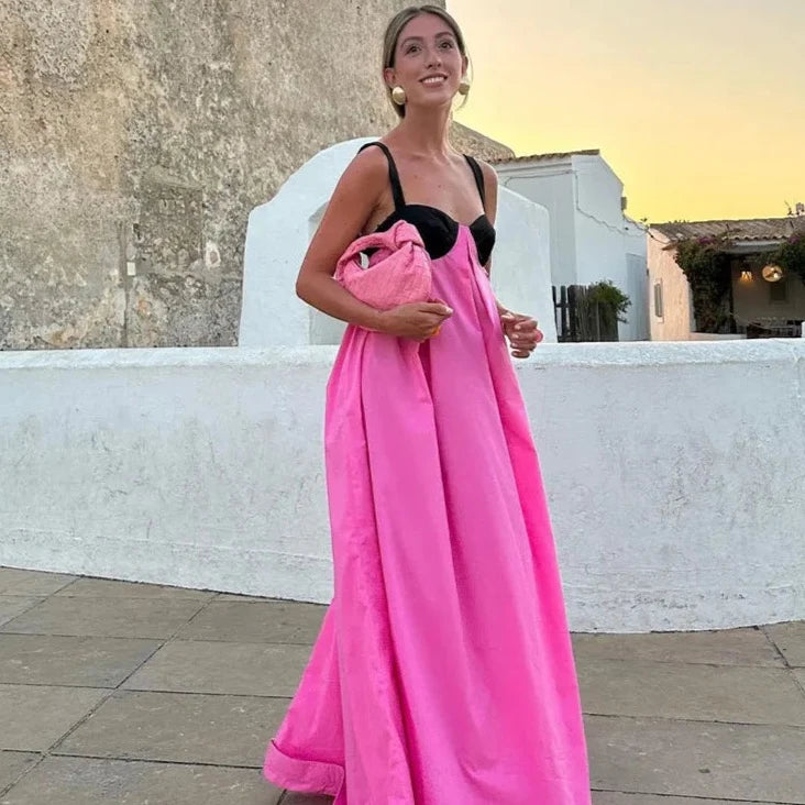 The Brisa Maxi Dress is an elegant and versatile addition to any wardrobe. With its backless design, lace-up detail, and spaghetti straps, this dress is both stylish and comfortable. Perfect for any occasion, from a night out to a formal event, the Brisa Maxi Dress is the ideal choice.