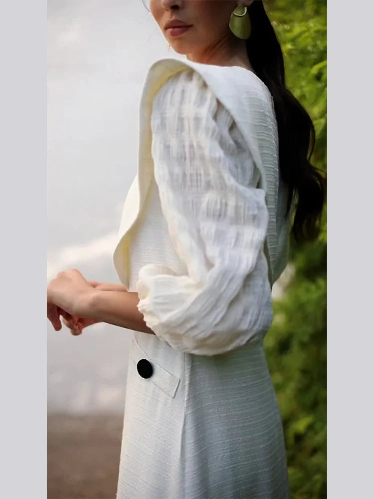 Indulge in luxury with Dress Sofia. This sophisticated maxi dress features a solid color and elegant pleats, perfect for any occasion. Its round neck and long sleeves add a touch of timeless style. Step into the world of haute couture with Dress Sofia.