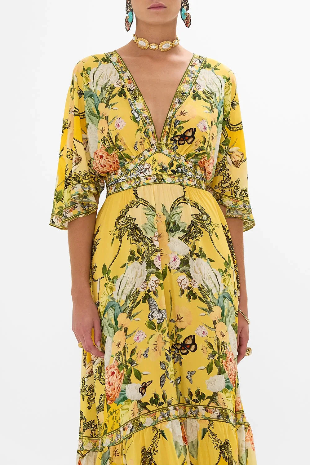 Capture the essence of ethereal beauty with our Silk-georgette Maxi Dress. Adorned with diamonds and printed with delicate patterns, this holiday fairy-inspired dress exudes a luxurious and exotic vibe. Embrace the ethnic charm and indulge in the opulence of this one-of-a-kind piece.