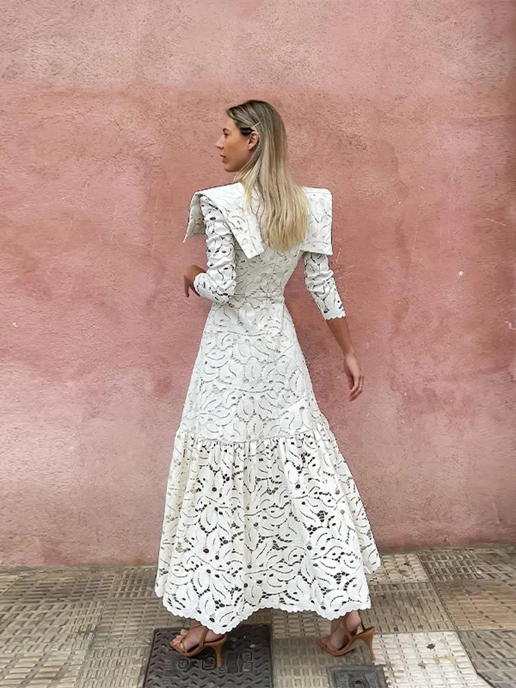 Discover elegant and timeless style in our Rosette Maxi Dress. Crafted with solid, high-quality lace, this dress features a slimming silhouette and long sleeves for a sophisticated look. The high waist adds a feminine touch to this must-have piece. Perfect for any special occasion.