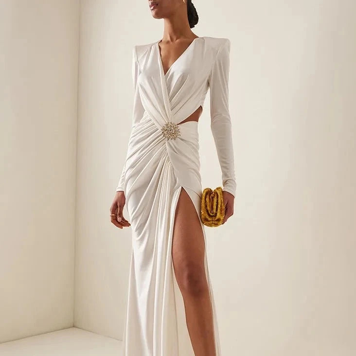 Elevate your evening look with the Zuhair Murad Phenix Brooch-Detailed Jersey Gown. Featuring a stunning brooch detail and crafted by the renowned designer Zuhair Murad, this gown combines elegance and luxury. Made from high-quality fabric, this gown not only provides a comfortable fit but also enhances your curves. Channel your inner diva and make a statement in this exquisite piece.