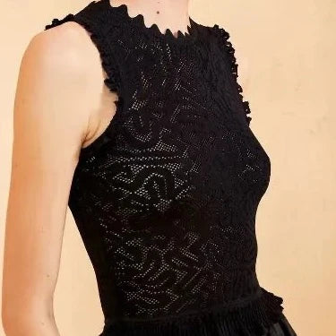 Introducing the Ulla Johnson Zoe Mesh Tank Top. With ruffled details, elastic knitted fabric, and a vintage-inspired design, this tank top is the perfect blend of casual and stylish. Stay comfortable all day while looking effortlessly chic.