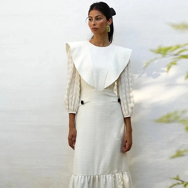 Indulge in luxury with Dress Sofia. This sophisticated maxi dress features a solid color and elegant pleats, perfect for any occasion. Its round neck and long sleeves add a touch of timeless style. Step into the world of haute couture with Dress Sofia.