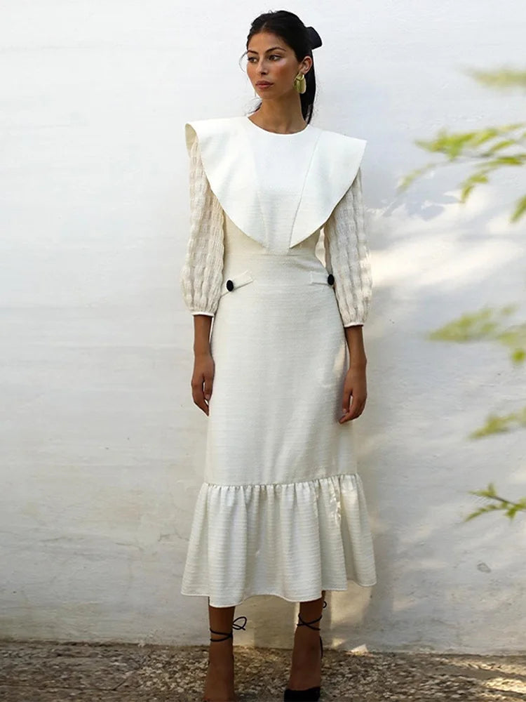 Indulge in luxury with Dress Sofia. This sophisticated maxi dress features a solid color and elegant pleats, perfect for any occasion. Its round neck and long sleeves add a touch of timeless style. Step into the world of haute couture with Dress Sofia.