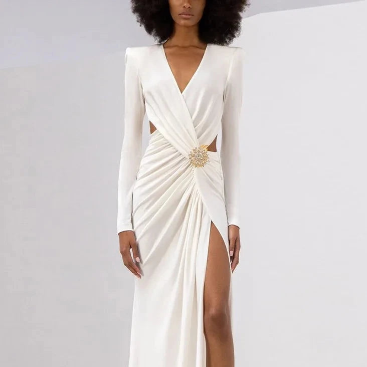 Elevate your evening look with the Zuhair Murad Phenix Brooch-Detailed Jersey Gown. Featuring a stunning brooch detail and crafted by the renowned designer Zuhair Murad, this gown combines elegance and luxury. Made from high-quality fabric, this gown not only provides a comfortable fit but also enhances your curves. Channel your inner diva and make a statement in this exquisite piece.