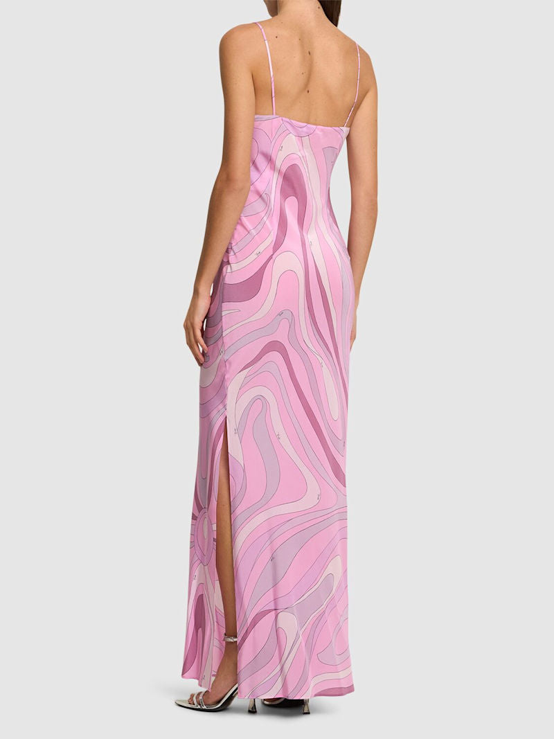 Elevate your special moments with the Marmo Silk Dress by Pucci. Made from luxurious crêpe de chine silk, this dress combines a smooth, lightweight feel with a flattering drape that moves gracefully with you. Its timeless silhouette and refined texture promise confidence and elegance, making it the perfect choice for occasions where you want to stand out beautifully.