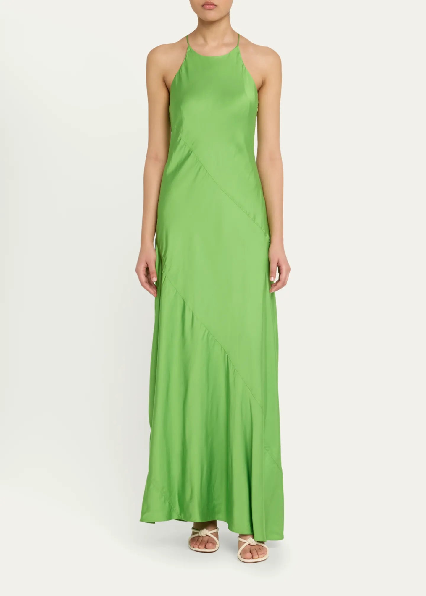 Elevate your elegance with the Sybil Satin Dress by A.L.C. This full-length, paneled satin gown features a sleek slip silhouette and a sophisticated high neckline that flatters every figure. Its sleeveless racerback design offers modern allure, while the side zip ensures a seamless fit. Crafted from luxurious viscose, this unlined dress promises comfort and style for unforgettable occasions. Make a striking statement with timeless grace.