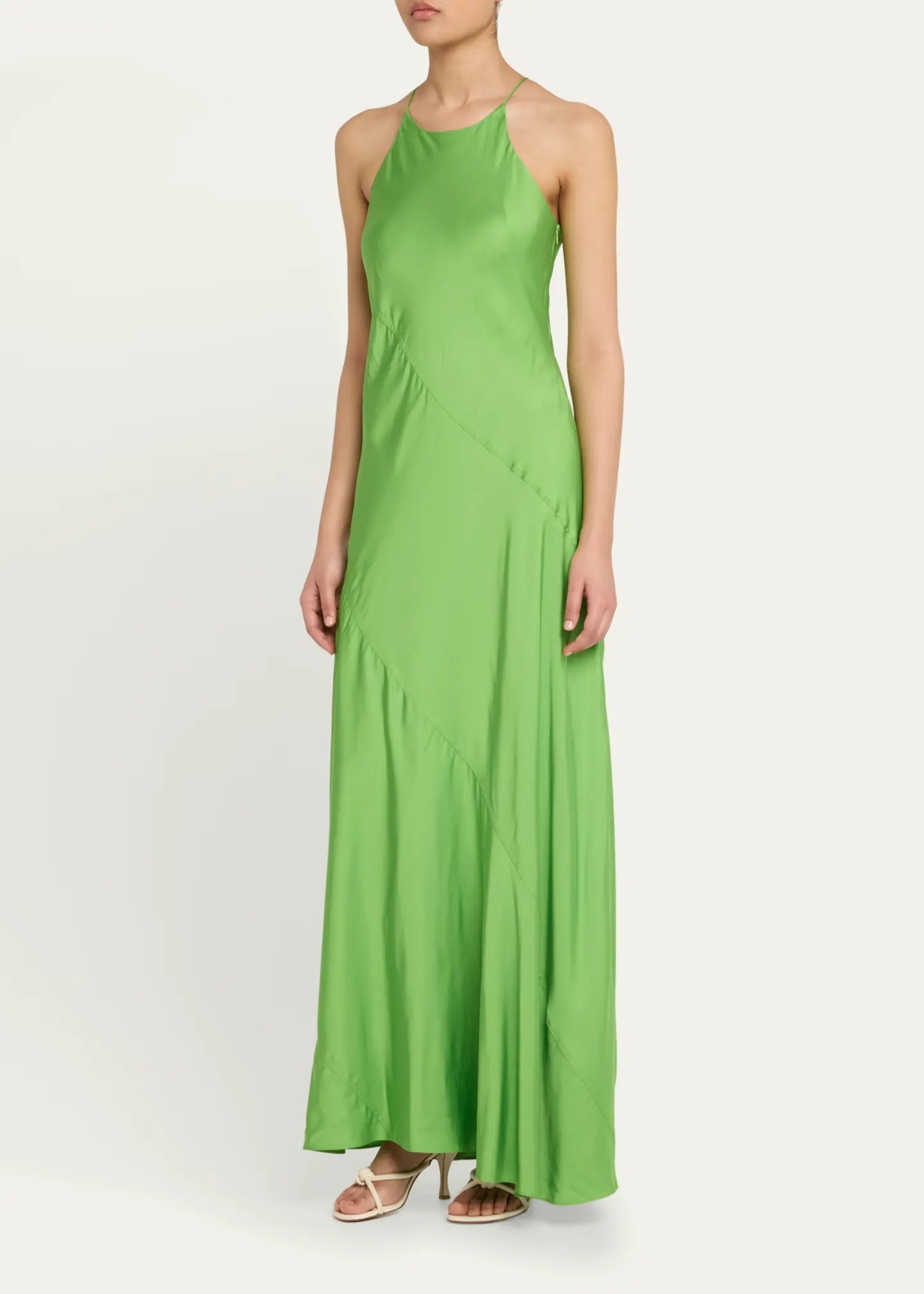 Elevate your elegance with the Sybil Satin Dress by A.L.C. This full-length, paneled satin gown features a sleek slip silhouette and a sophisticated high neckline that flatters every figure. Its sleeveless racerback design offers modern allure, while the side zip ensures a seamless fit. Crafted from luxurious viscose, this unlined dress promises comfort and style for unforgettable occasions. Make a striking statement with timeless grace.