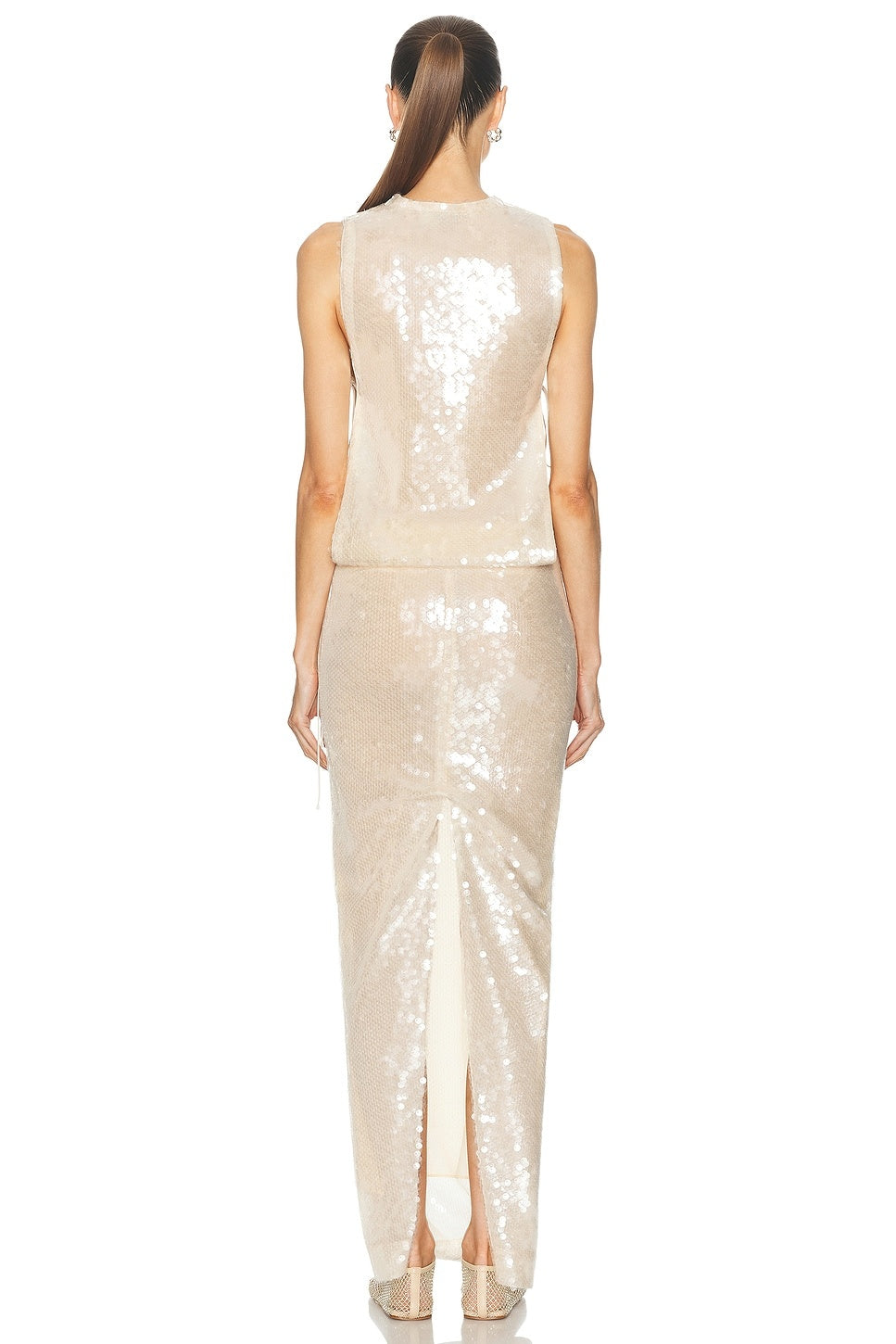 Elevate your evening presence with the Lucent Sequin Separation Gown by Christopher Esber, crafted in dazzling sequin-embellished fabric for a radiant glow. This fully lined gown features a sleek shoulder zipper closure for a smooth fit, elastic stretch at the waist for comfort, and a stylish back slit that adds graceful movement. Open sides with delicate tie-up accents create a modern silhouette, perfect for making a lasting impression. 