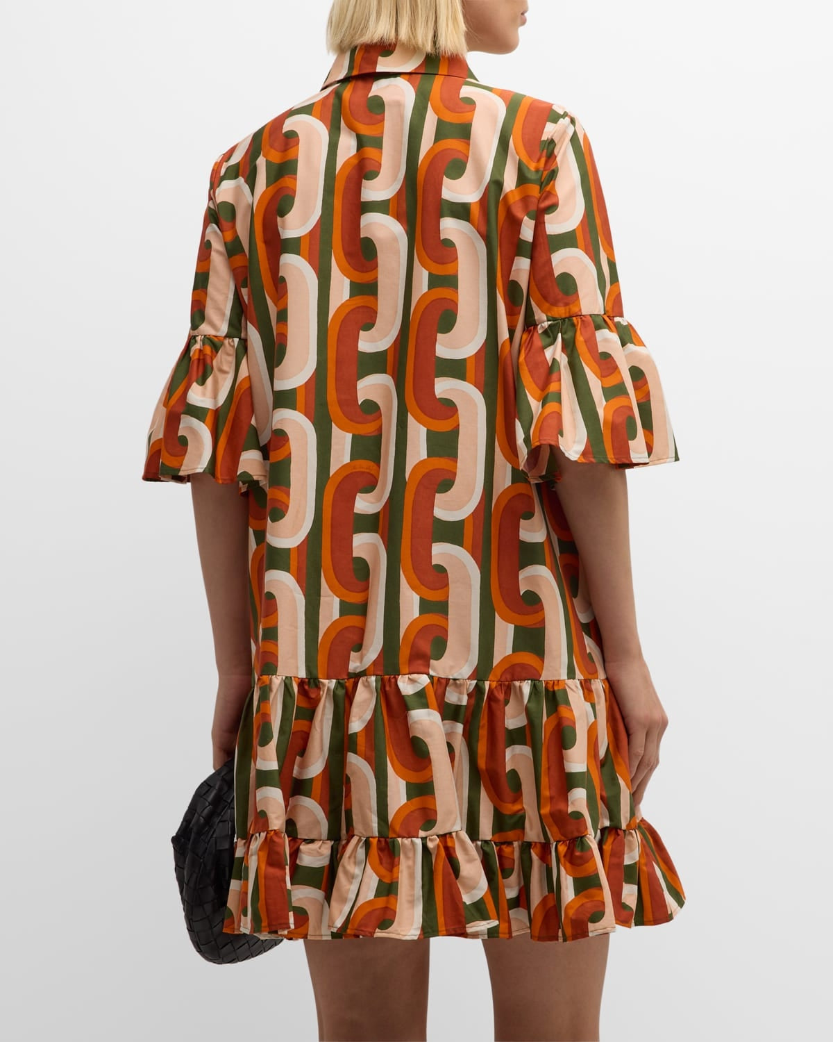 Elevate your everyday wardrobe with the DoubleJ Choux shirtdress, a sophisticated Italian-crafted piece that effortlessly transitions from day to night. This cotton mini dress features an eye-catching chain-link print and charming tiered ruffle hem that adds movement and dimension. The classic point collar and button-front design offer timeless appeal, while practical side split pockets keep essentials within reach. 