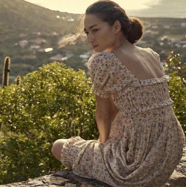 Indulge in luxury with the Gia Dress from Doen. Made with ruffle floral printed cotton, this midi maxi gown dress exudes elegance and sophistication. Its ruffled detailing adds a touch of femininity, making it the perfect statement piece for any occasion. Elevate your wardrobe with this exclusive and tasteful dress.