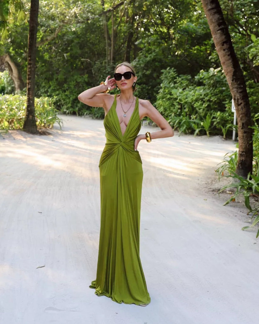 Elevate your evening in the Open-back Twist-front Jersey Gown by Tom Ford. Designed to impress, the plunging neckline and twisted front create beautiful drapes that flow to the floor. With eye-catching rolled shoulder straps and an alluring open back, this gown will make you the center of attention.