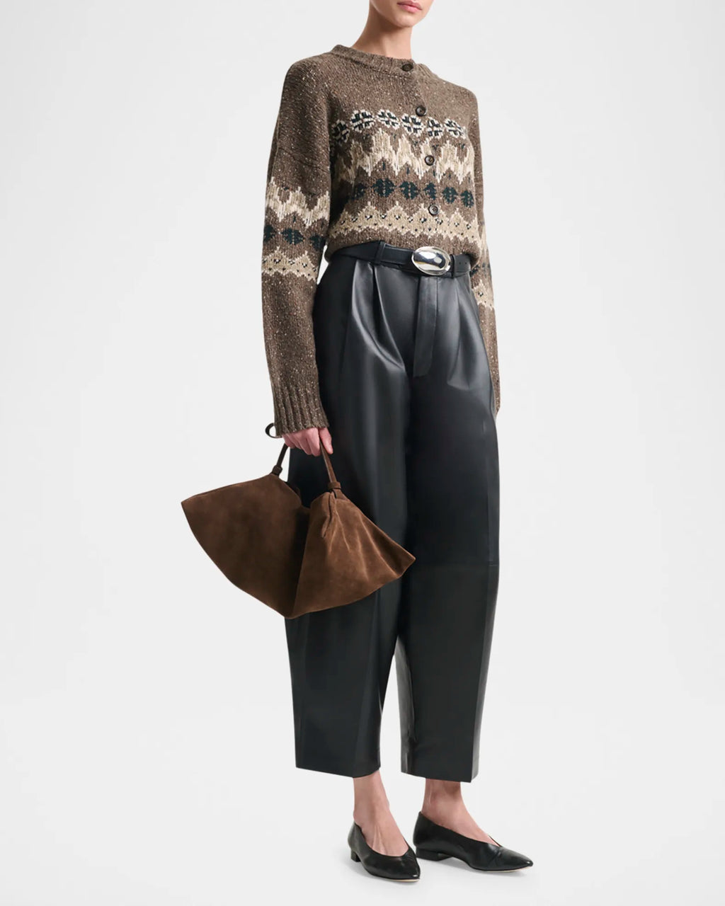 Elevate your everyday style with the Altuzarra Cammie Fair Isle Crop Cardigan, a sophisticated piece that effortlessly transitions from season to season. This relaxed-fit cardigan showcases a striking fair isle intarsia pattern that adds visual interest and texture to any outfit. Designed with drop shoulders and a cropped silhouette, it creates a flattering, modern proportion that pairs beautifully with high-waisted bottoms. 