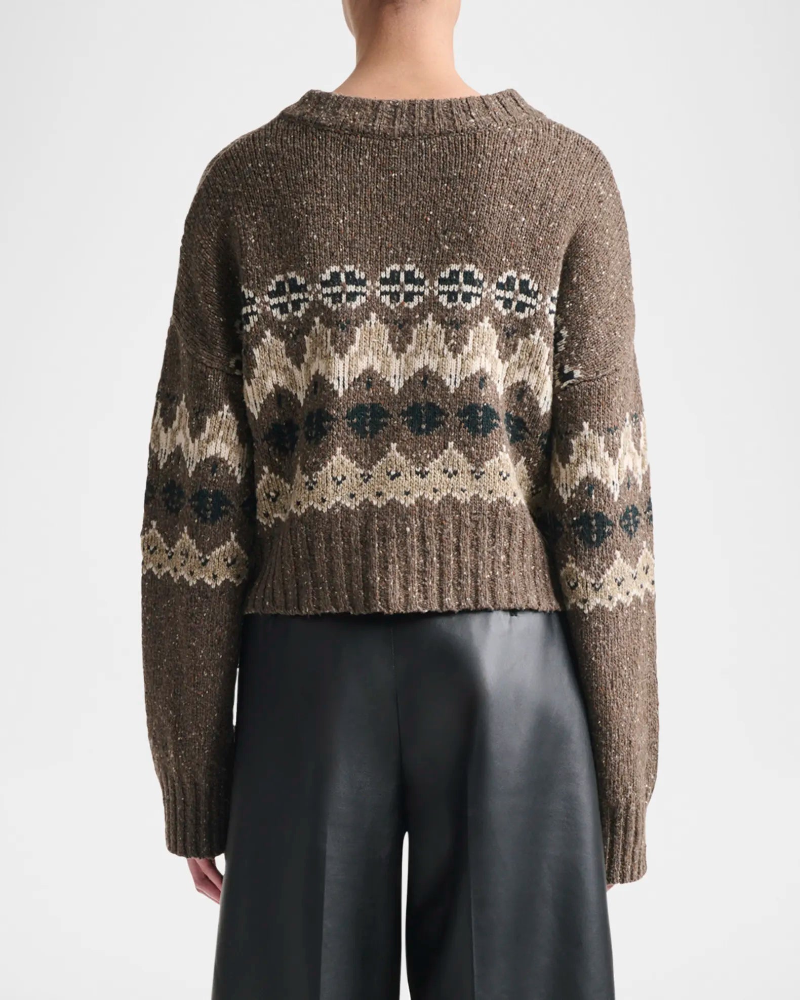 Elevate your everyday style with the Altuzarra Cammie Fair Isle Crop Cardigan, a sophisticated piece that effortlessly transitions from season to season. This relaxed-fit cardigan showcases a striking fair isle intarsia pattern that adds visual interest and texture to any outfit. Designed with drop shoulders and a cropped silhouette, it creates a flattering, modern proportion that pairs beautifully with high-waisted bottoms. 