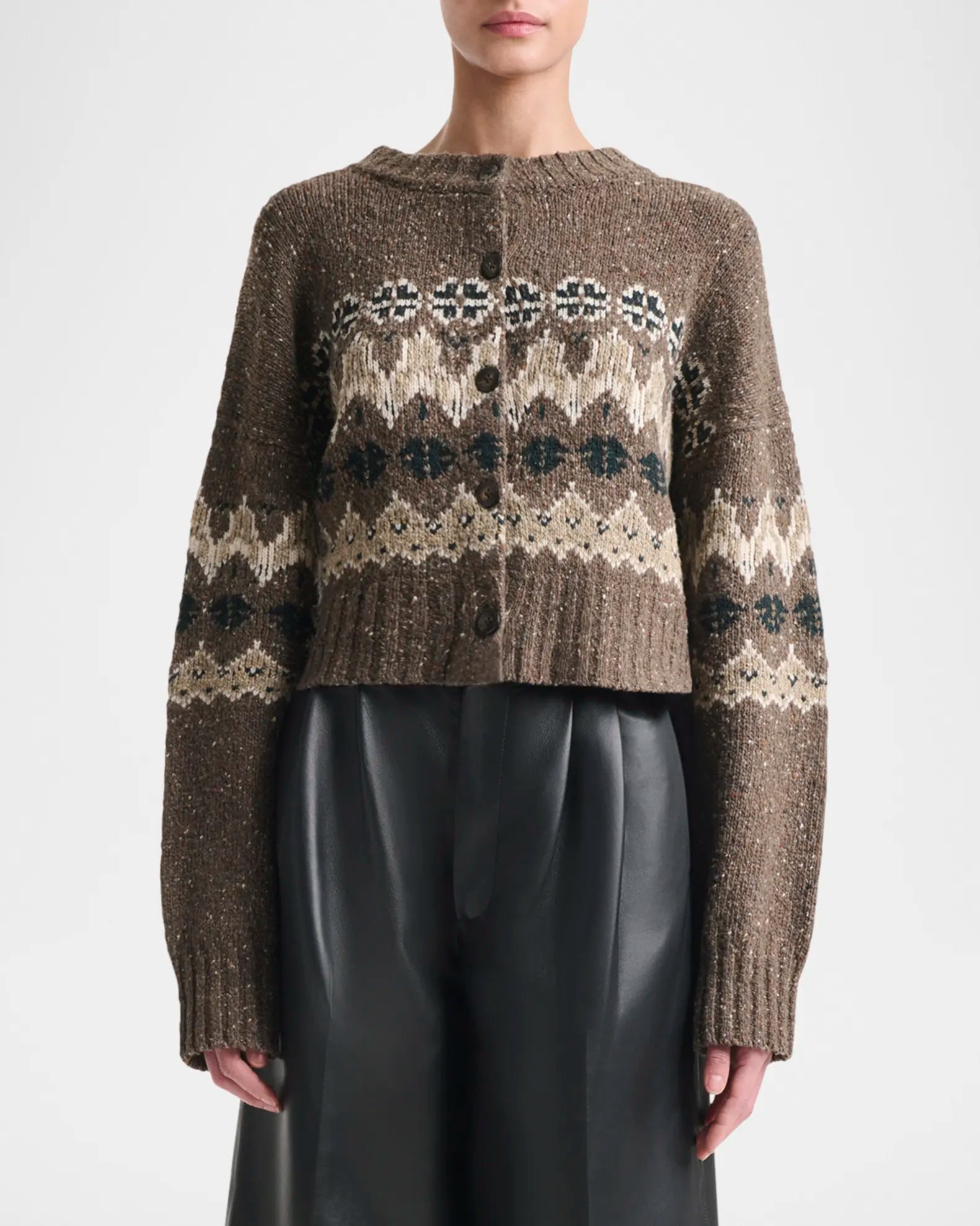 Elevate your everyday style with the Altuzarra Cammie Fair Isle Crop Cardigan, a sophisticated piece that effortlessly transitions from season to season. This relaxed-fit cardigan showcases a striking fair isle intarsia pattern that adds visual interest and texture to any outfit. Designed with drop shoulders and a cropped silhouette, it creates a flattering, modern proportion that pairs beautifully with high-waisted bottoms. 