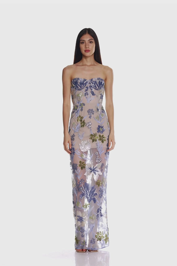 Embrace effortless elegance with the Dahlia Baby Blue Multi Maxi Dress by Bronx and Banco. Featuring a strapless design and a full-length silhouette, this dress drapes beautifully for a graceful, flowing look. The dual-ended zipper at the back ensures a flawless fit and easy wear, making it perfect for both casual and special occasions. Its soft, dreamy hues add a touch of versatility to your wardrobe, ideal for capturing timeless style wherever you go.