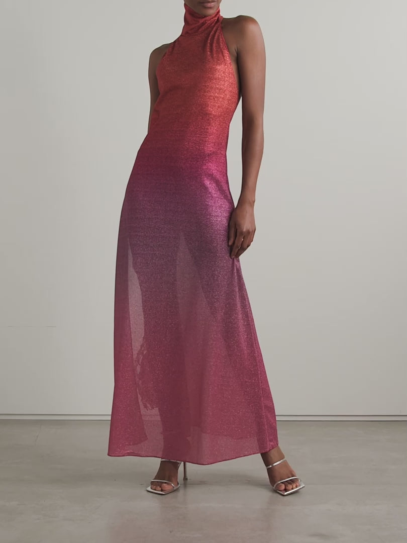 Elevate your evening with the Lumière maxi dress, designed to captivate in metallic ombrè stretch-knit fabric. Its halterneck silhouette beautifully frames your shoulders while the form-fitting stretch ensures a flattering fit that moves with you. Perfect for making a bold statement, this dress blends comfort and glamour effortlessly, turning heads from sunset to late night. Embrace your daring side with OSÉREE’s standout piece.
