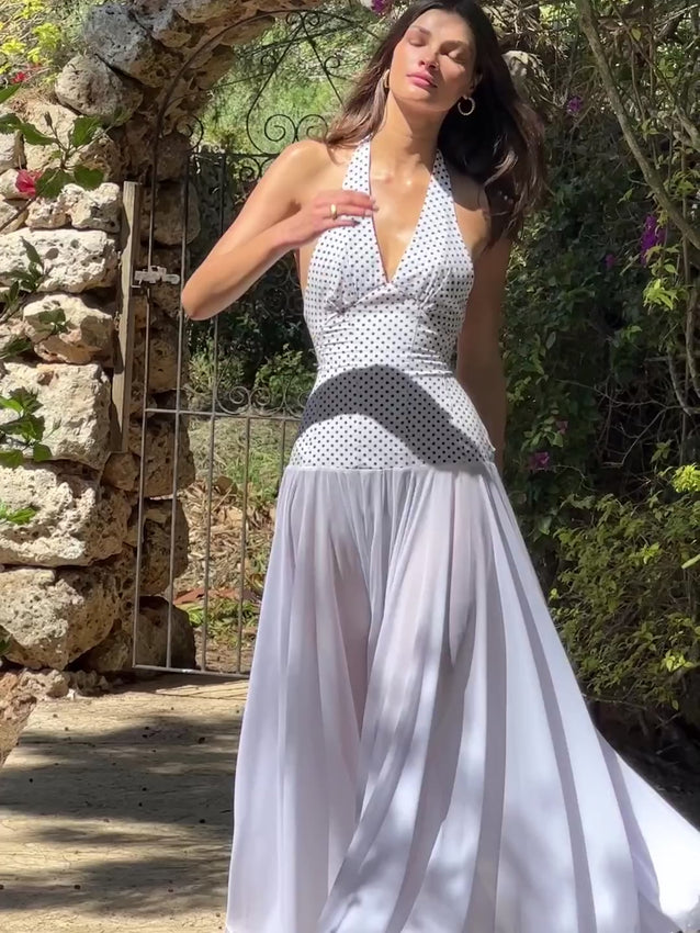 Get ready to turn heads in the Rosalia Maxi Dress. The halterneck tie top and double layered chiffon dress create a flirty and feminine silhouette, while the tailored fit accentuates your waistline. Perfect for weddings, bachelorettes, birthdays, and any special occasion. Comes with a concealed side zip for a seamless look.