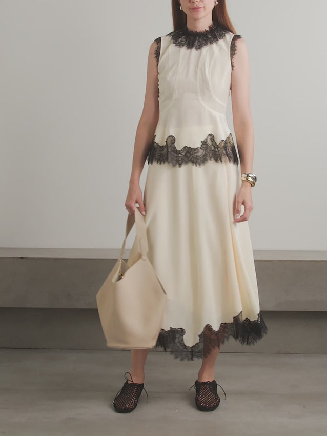 The Bette Silk Top from Ulla Johnson combines elegant craftsmanship with versatile style. Crafted from luxurious silk crepe de chine, this slim-fit top features delicate lace trim and curved seams that flatter your silhouette. Perfect when paired with the matching Rosine skirt or worn casually with jeans, it effortlessly elevates any outfit with refined sophistication.