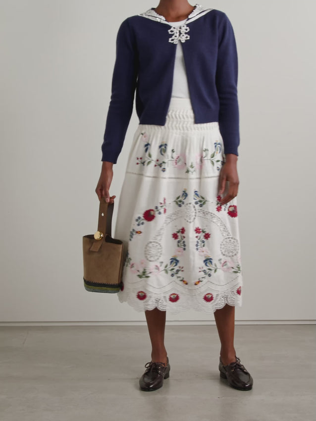 Elevate your wardrobe with the Celia midi skirt by SEA, a refined piece that seamlessly blends timeless elegance with modern comfort. Crafted from a luxurious cotton and linen blend, this skirt features delicate broderie anglaise detailing that adds an understated sophistication to any ensemble. The midi length offers versatility for both casual and dressed-up occasions, while the breathable fabric ensures all-day wearability. 