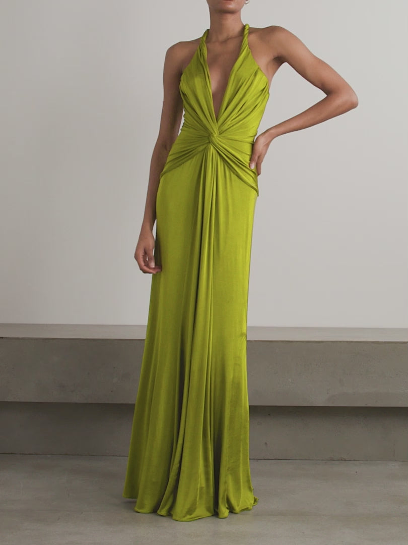Elevate your evening in the Open-back Twist-front Jersey Gown by Tom Ford. Designed to impress, the plunging neckline and twisted front create beautiful drapes that flow to the floor. With eye-catching rolled shoulder straps and an alluring open back, this gown will make you the center of attention.
