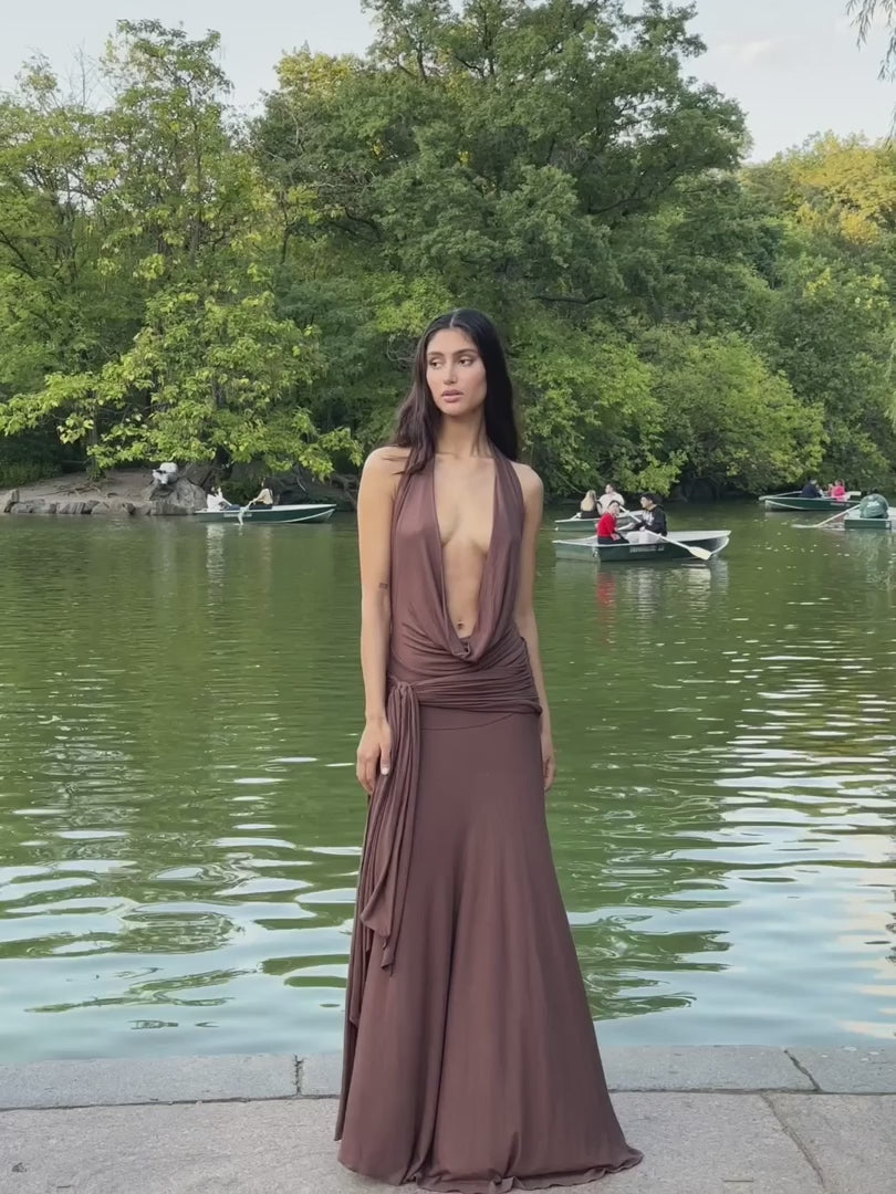 Make a grand entrance in the Halter Maxi Dress. Its figure-hugging silhouette and deep, plunging neckline exude elegance. The backless, halterneck shape adds a touch of allure. Slip on this floor-length dress with cowl front and wide hem for a luxurious, sophisticated look. Perfect for after-dark events.