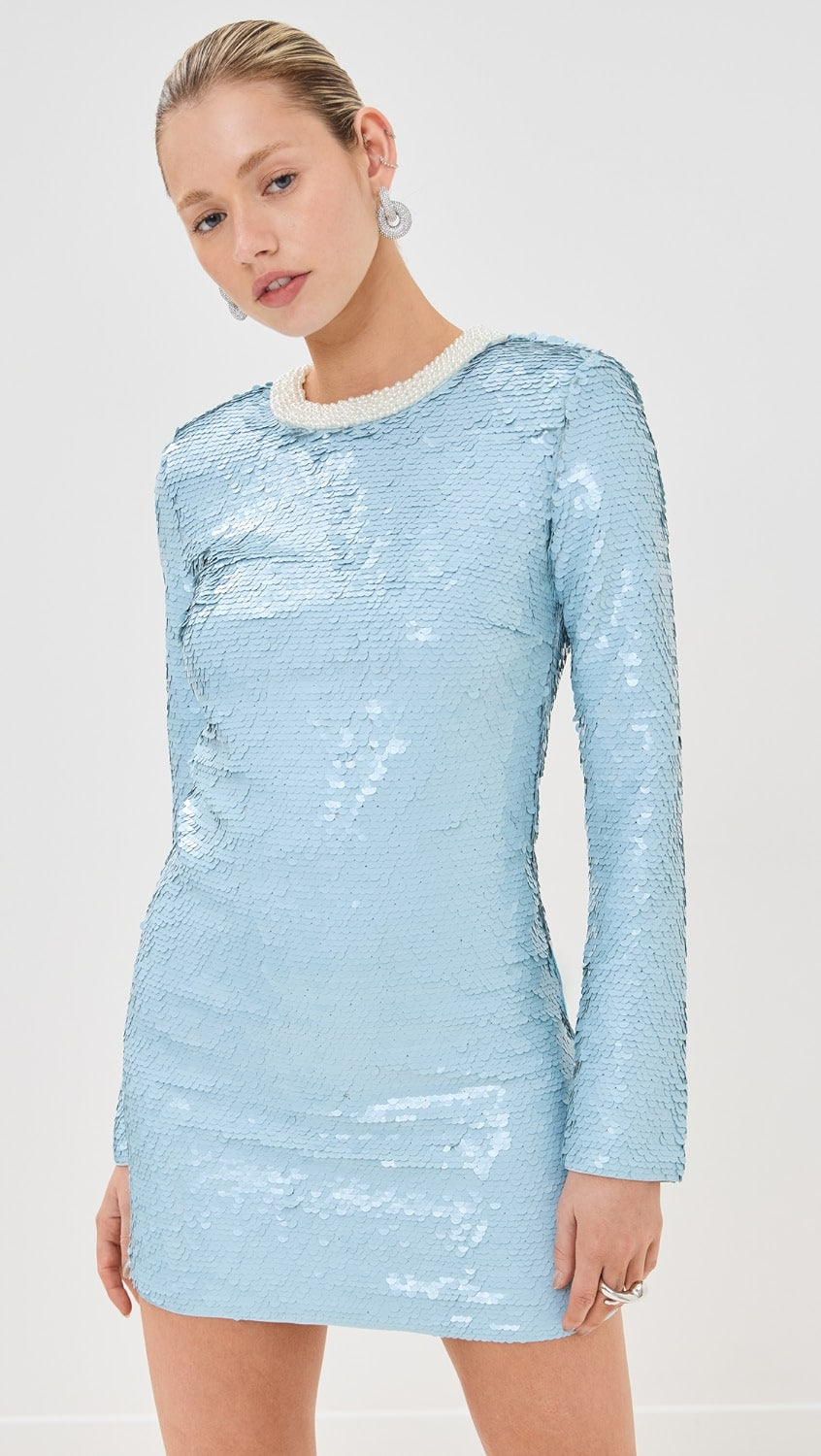 Elevate your style with the Blue Sequin Mini Dress! This mid-weight, non-stretch sequined mesh dress features contrast beaded trim, padded shoulders, and a mini length for a dazzling look. With a crew neck, long sleeves, and hook-and-eye and hidden zip closure at the back, this dress is both chic and comfortable.