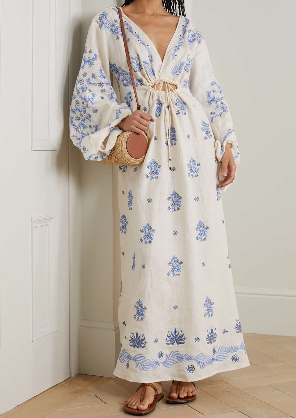 Indulge in the exquisite craftsmanship of the Francisca Tinaja Cutout Embroidered Linen Maxi Dress. This Agua by Agua Bendita creation features cooling linen and intricate floral embroidery, inspired by local flora. With delicate ties ensuring the blouson sleeves stay put, this dress is perfect for a special occasion.