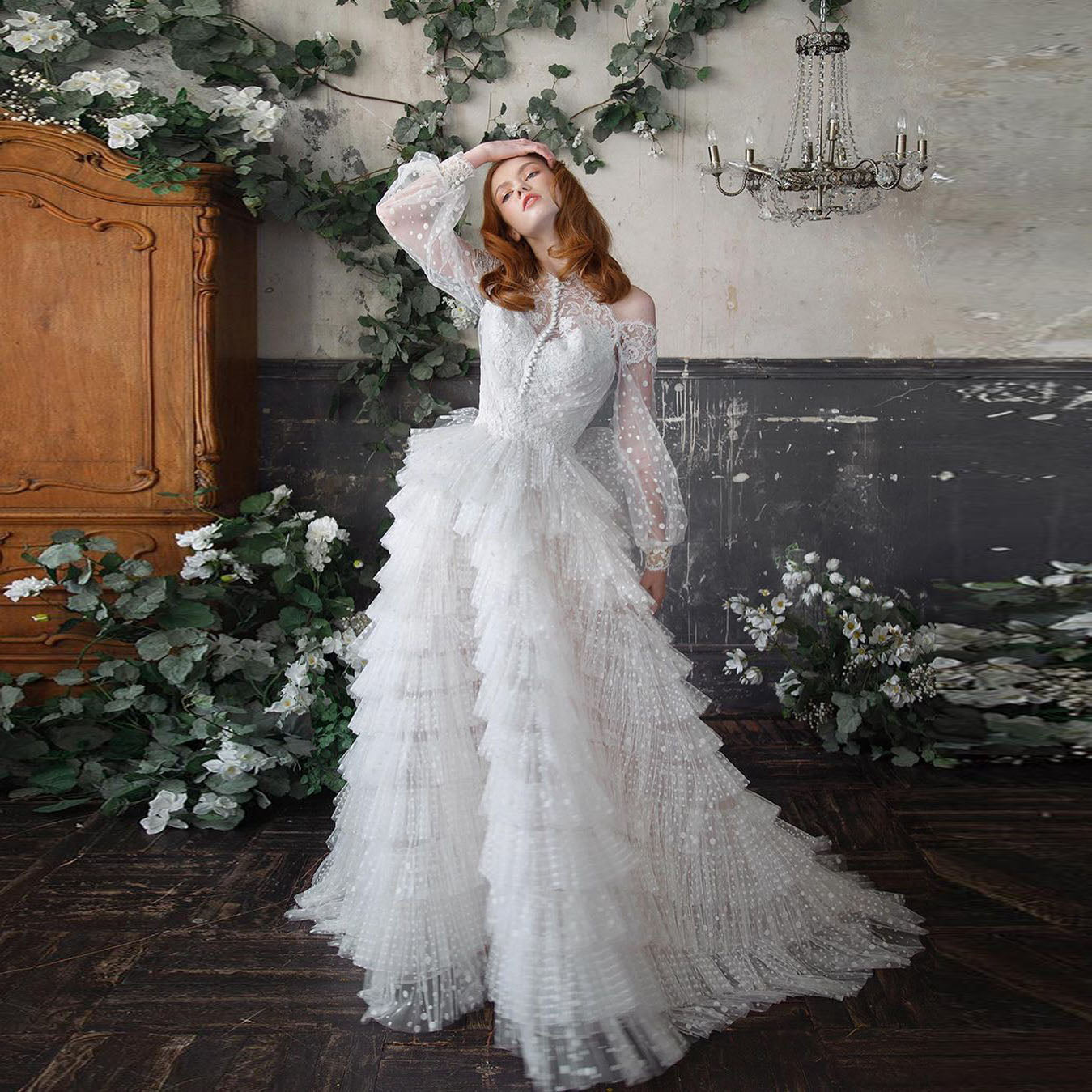 Indulge in the opulence of the Robe Domini. This luxurious white ruffled princess ball gown exudes elegance and sophistication. Designed to make you feel like a modern-day princess, it is perfect for any special occasion. With its intricate ruffles and regal silhouette, this gown is a true work of art. Elevate your wardrobe and make a statement with the Robe Domini.