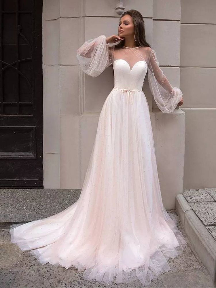 As a bridal industry expert, I introduce the elegant Robe Lumi, an A-line bridal gown designed to enhance your natural figure. Its timeless silhouette will provide a sophisticated yet romantic look for your special day. Experience the perfect blend of modern elegance and traditional beauty with Robe Lumi.