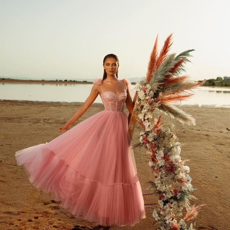 This elegant ball gown sparkling dress, named Robe Jackalinne, is perfect for any formal occasion. Made with high-quality materials, it will ensure a glamorous and unforgettable look. Its sparkling details will catch the eye and make you stand out in the crowd.