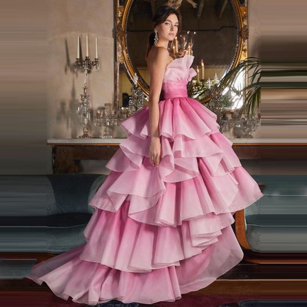 Experience effortless elegance with the Robe Phaedra. This beautiful ball gown features soft ruffles that will take you from evening galas to formal occasions with ease. Crafted with premium fabrics, this dress is sure to make a statement and ensure a timeless, sophisticated look.