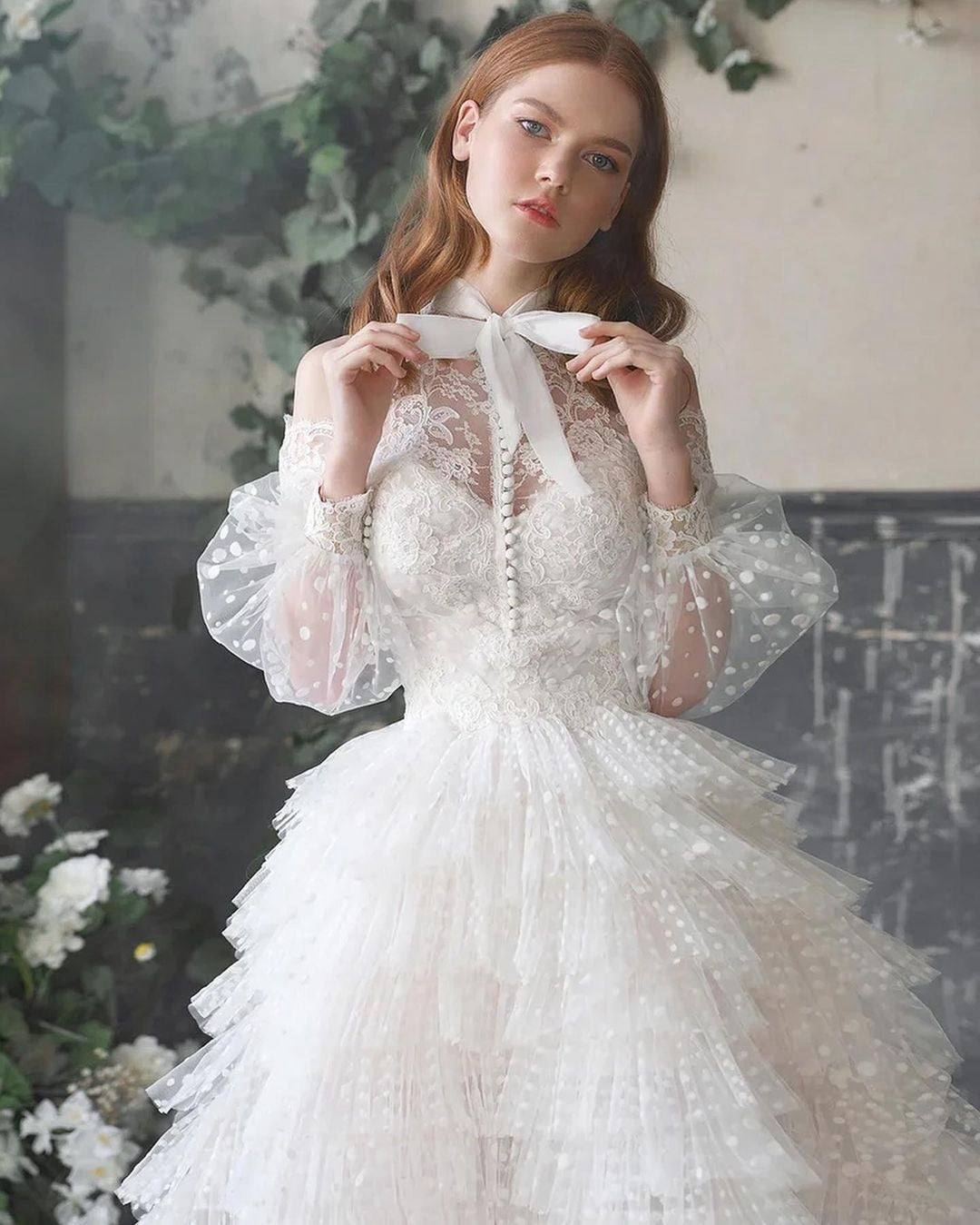 Indulge in the opulence of the Robe Domini. This luxurious white ruffled princess ball gown exudes elegance and sophistication. Designed to make you feel like a modern-day princess, it is perfect for any special occasion. With its intricate ruffles and regal silhouette, this gown is a true work of art. Elevate your wardrobe and make a statement with the Robe Domini.