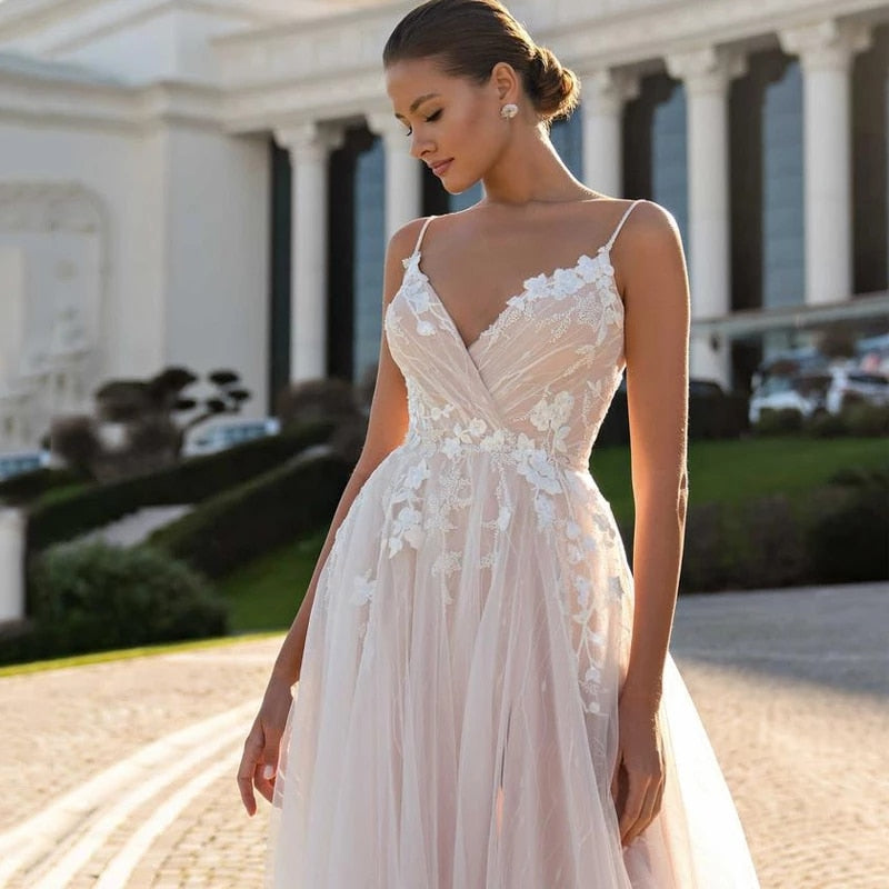 This chic and elegant wedding gown, the Robe Suzee, features a beautiful v-neck and intricate embroidery. Designed for the modern bride, this dress exudes sophistication and style. The v-neck adds a touch of glamour while the embroidery adds intricate detail, making this dress a perfect choice for any bride looking to make a statement on her special day.