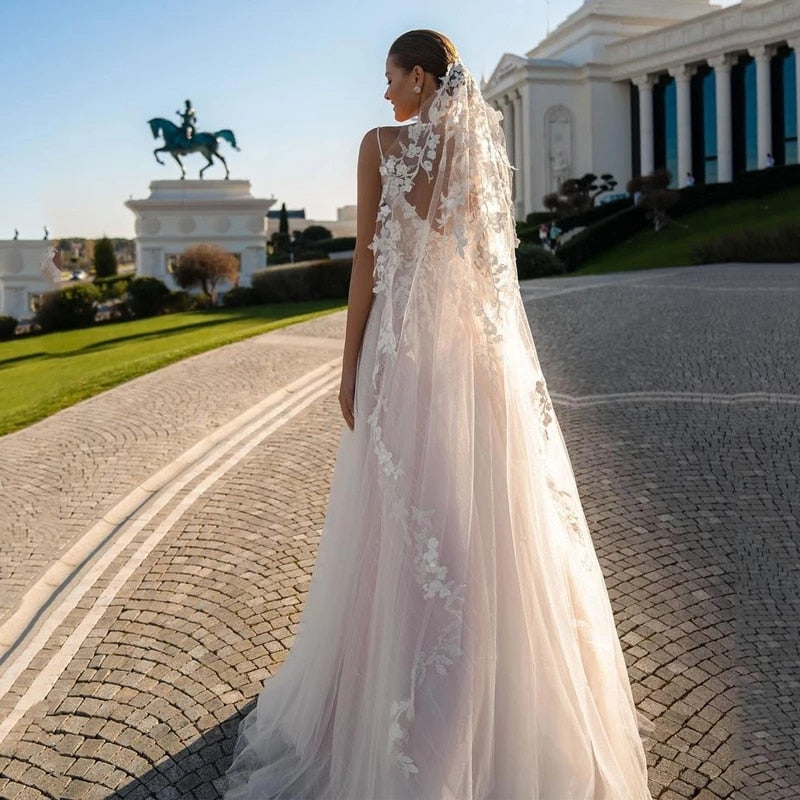 This chic and elegant wedding gown, the Robe Suzee, features a beautiful v-neck and intricate embroidery. Designed for the modern bride, this dress exudes sophistication and style. The v-neck adds a touch of glamour while the embroidery adds intricate detail, making this dress a perfect choice for any bride looking to make a statement on her special day.