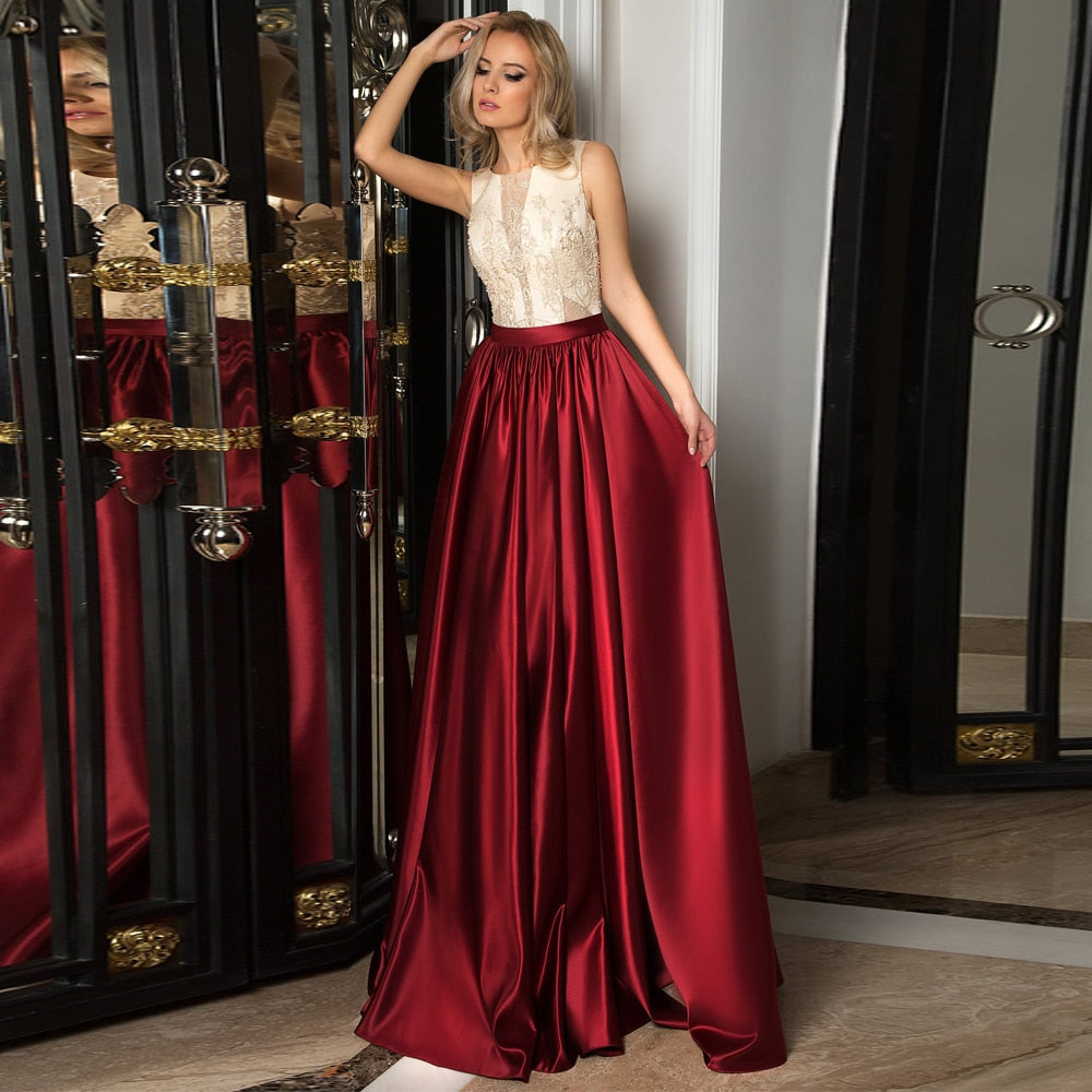 Introducing the Robe Salina - the perfect evening gown for any special occasion. Crafted from elegant burgundy satin, this gown exudes sophistication and style. Make a statement and turn heads with this stunning piece that will make you feel confident and beautiful.