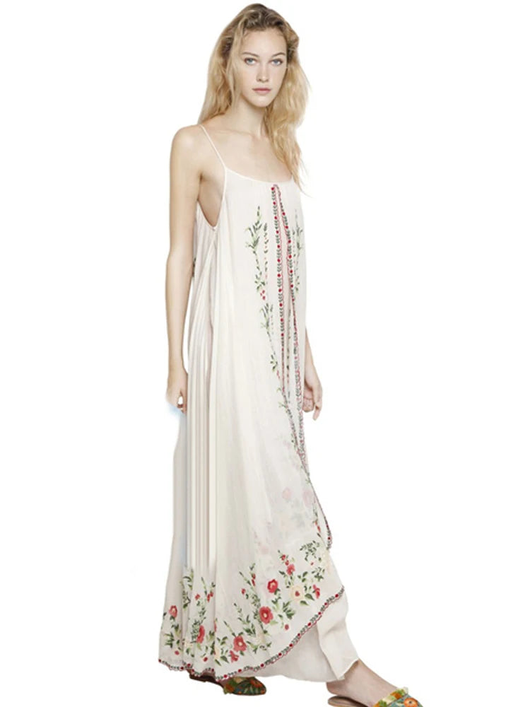 Introducing the Dress Josephine, the perfect summer dress with retro national wind design and delicate flower embroidery. Travel in style with this bohemian beach dress that comes with a halter belt for a flawless fit. Embrace the comfort and elegance of this must-have addition to your wardrobe.