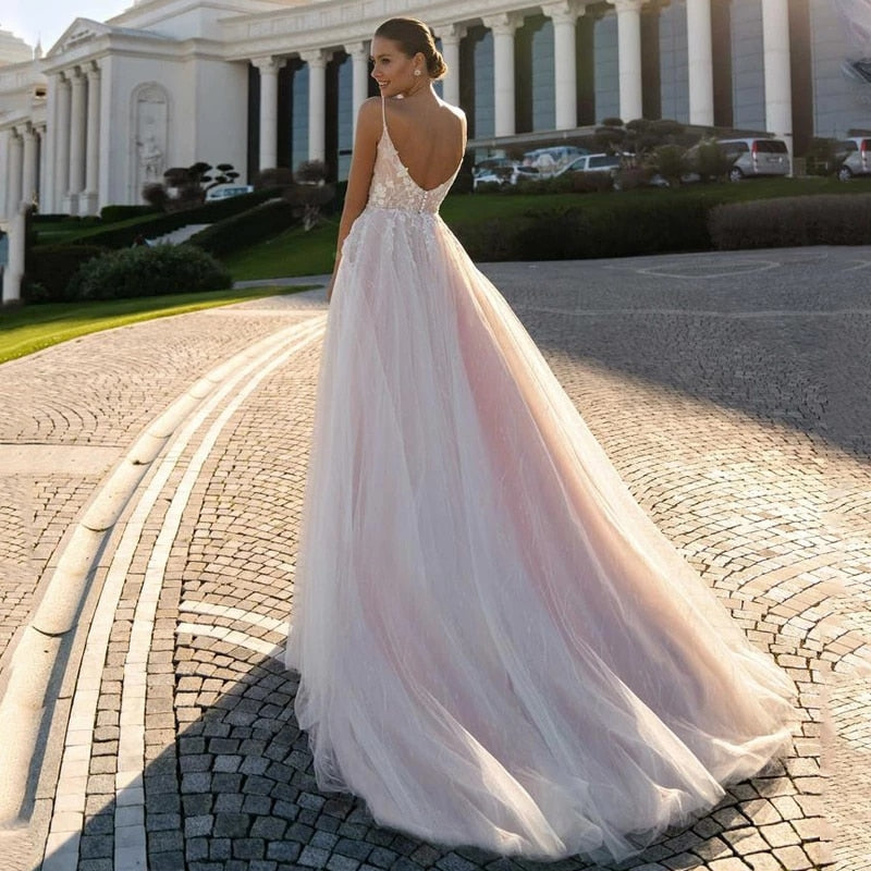 This chic and elegant wedding gown, the Robe Suzee, features a beautiful v-neck and intricate embroidery. Designed for the modern bride, this dress exudes sophistication and style. The v-neck adds a touch of glamour while the embroidery adds intricate detail, making this dress a perfect choice for any bride looking to make a statement on her special day.