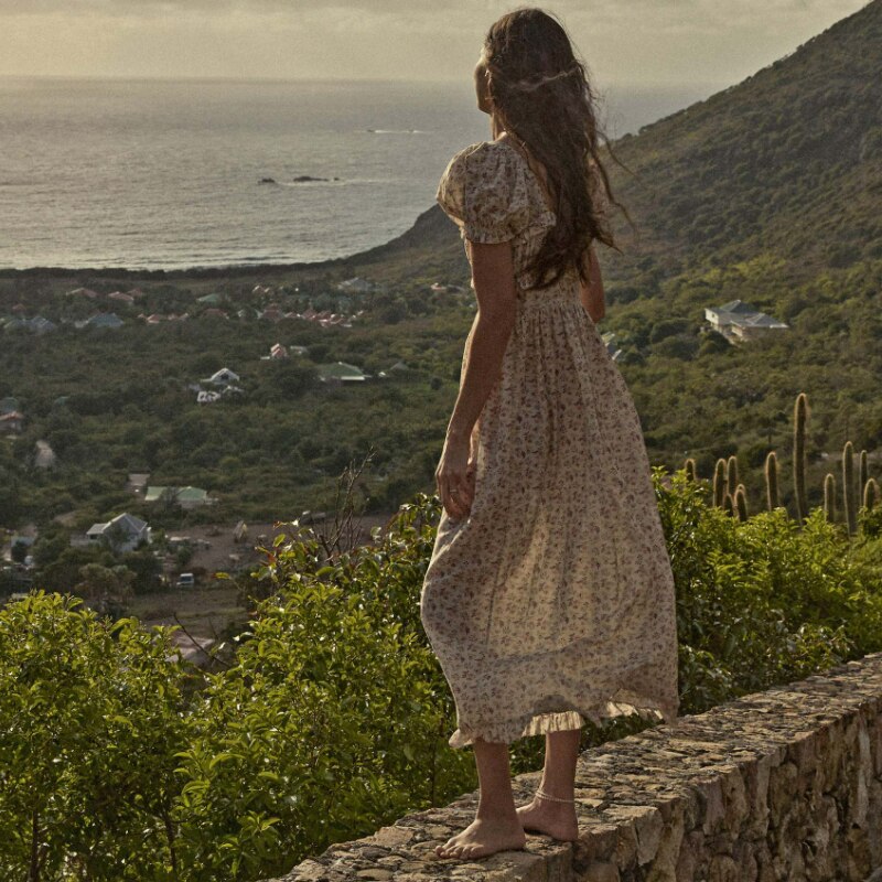 Indulge in luxury with the Gia Dress from Doen. Made with ruffle floral printed cotton, this midi maxi gown dress exudes elegance and sophistication. Its ruffled detailing adds a touch of femininity, making it the perfect statement piece for any occasion. Elevate your wardrobe with this exclusive and tasteful dress.