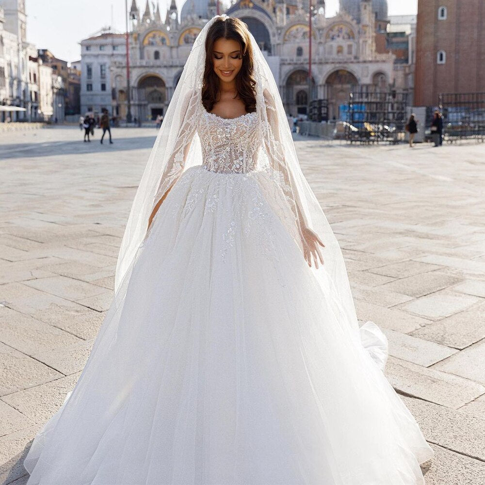 The Robe Regina is the epitome of elegance and sophistication. With its delicate lace and pearl embellishments, this bohemian-style bridal gown is sure to turn heads. The wide straps provide comfort and support while the square neckline adds a touch of modernity. Perfect for the chic and stylish bride.