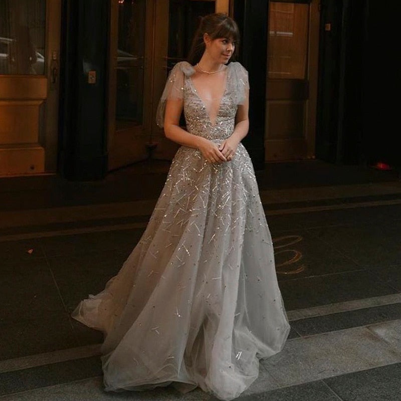 Elevate your inner fairy goddess with the Robe Soraya. Enchant onlookers with the sparkling details and elegant design of this prom dress. Make a statement and feel confident in this one-of-a-kind gown. Perfect for any special occasion!