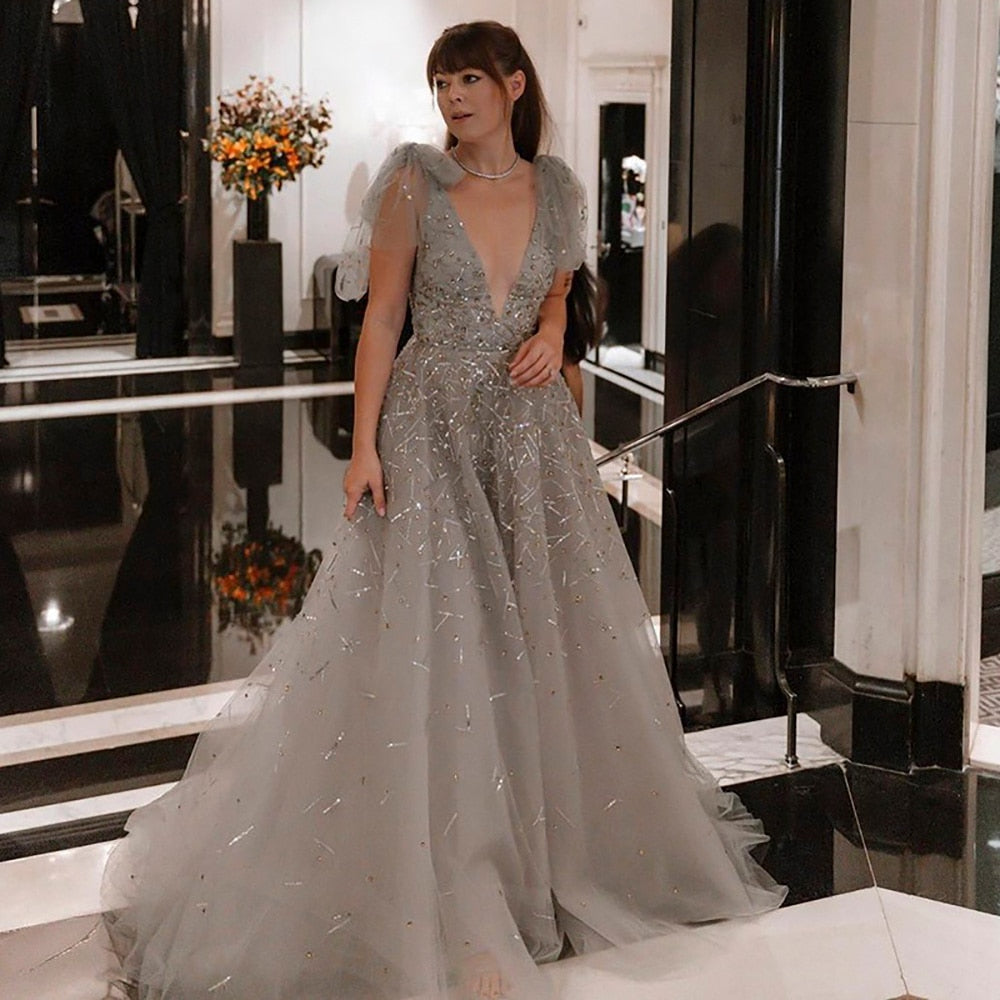 Elevate your inner fairy goddess with the Robe Soraya. Enchant onlookers with the sparkling details and elegant design of this prom dress. Make a statement and feel confident in this one-of-a-kind gown. Perfect for any special occasion!