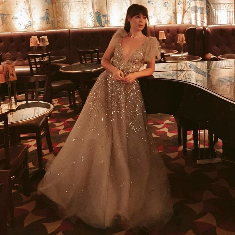 Elevate your inner fairy goddess with the Robe Soraya. Enchant onlookers with the sparkling details and elegant design of this prom dress. Make a statement and feel confident in this one-of-a-kind gown. Perfect for any special occasion!