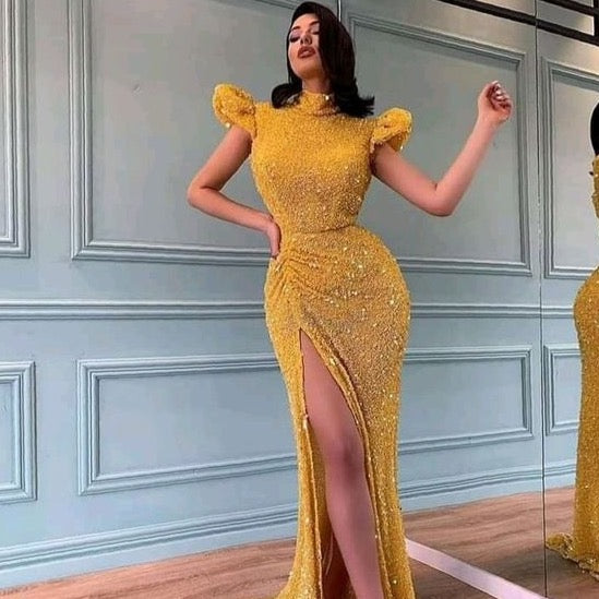 Take a daring leap into seductive style in the vibrant yellow mermaid Robe Nasha. Sparkle like the night sky in this beautiful ball gown, designed to draw all eyes to you. Be daring. Be bold. Feel sexy.
