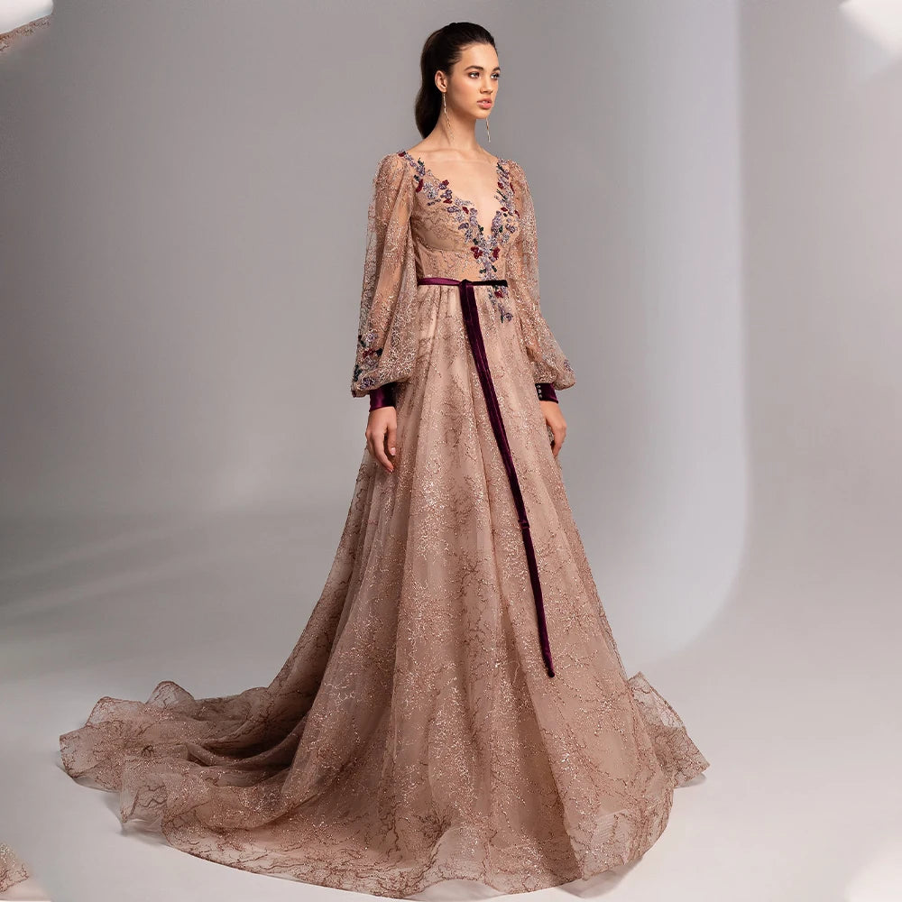 Elevate your formalwear game with our Dress Octavia. The charming flesh-pink color, long sleeves, V-neckline, and stunning A-line silhouette create a timeless and elegant look. With a custom-made fit and sweep train, this dress will make you feel like a true prom queen. Available in various sizes.