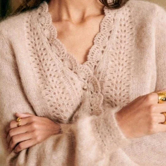 Introducing the Cardigan Angelie, a delicate wool blend cardigan perfect for spring and summer. Designed with gentle crochet knitted details, this cardigan offers both style and comfort. Stay fashionable and cool with this must-have addition to your wardrobe.